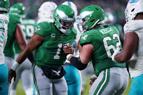 Hurts passes for 279 yards throws a TD and runs for one in Eagles